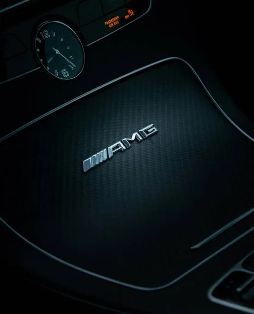 AMG badge on a carbon fiber panel
