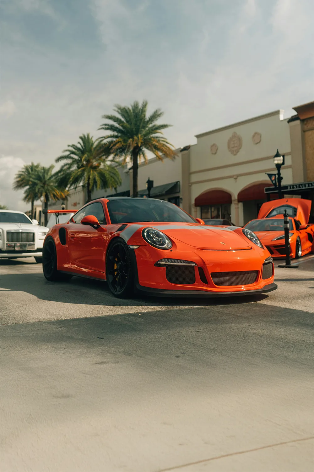 Orange Porsche outside Pristine Collision Center