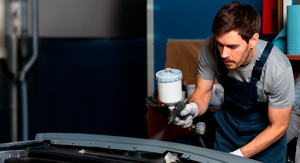 A man painting a car