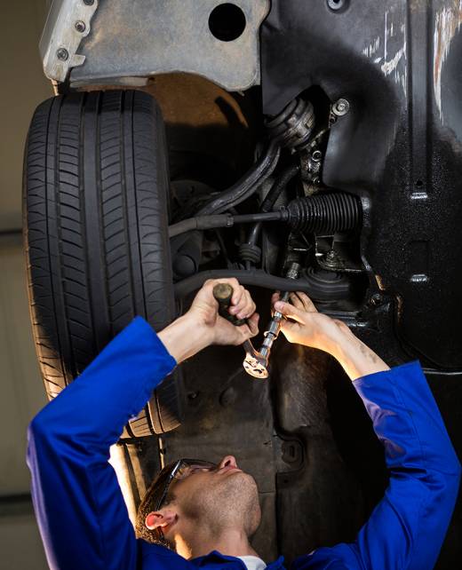 mechanic-servicing-carSuspension-Alignment-Services- mechanic-servicing-carSuspension-Alignment-Services-